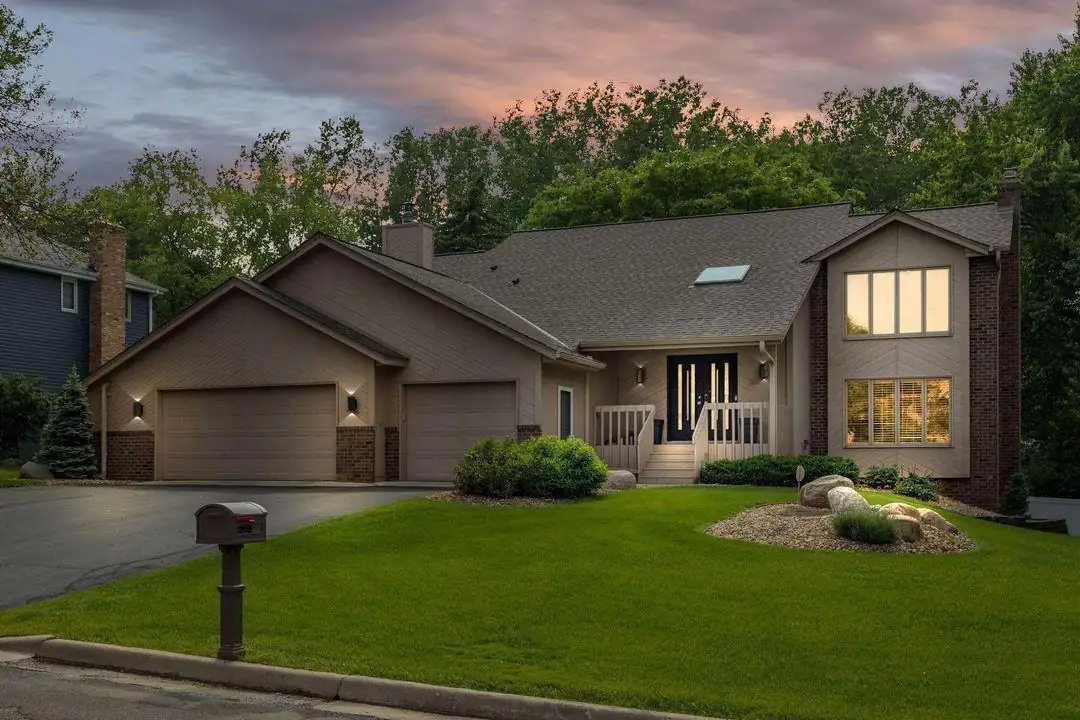 The Twin Cities Living Assistance home in Burnsville at dusk, windows lit