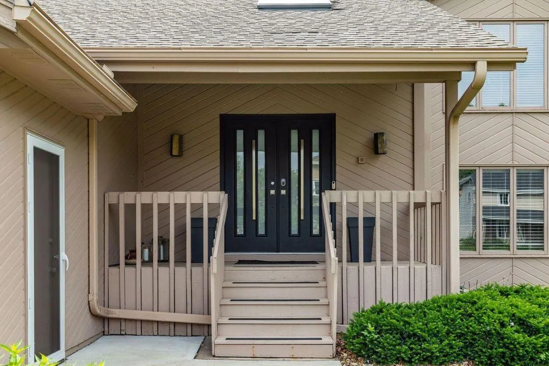 Front porch and steps of the Twin Cities Living Assistance home in Burnsville on a sunny day