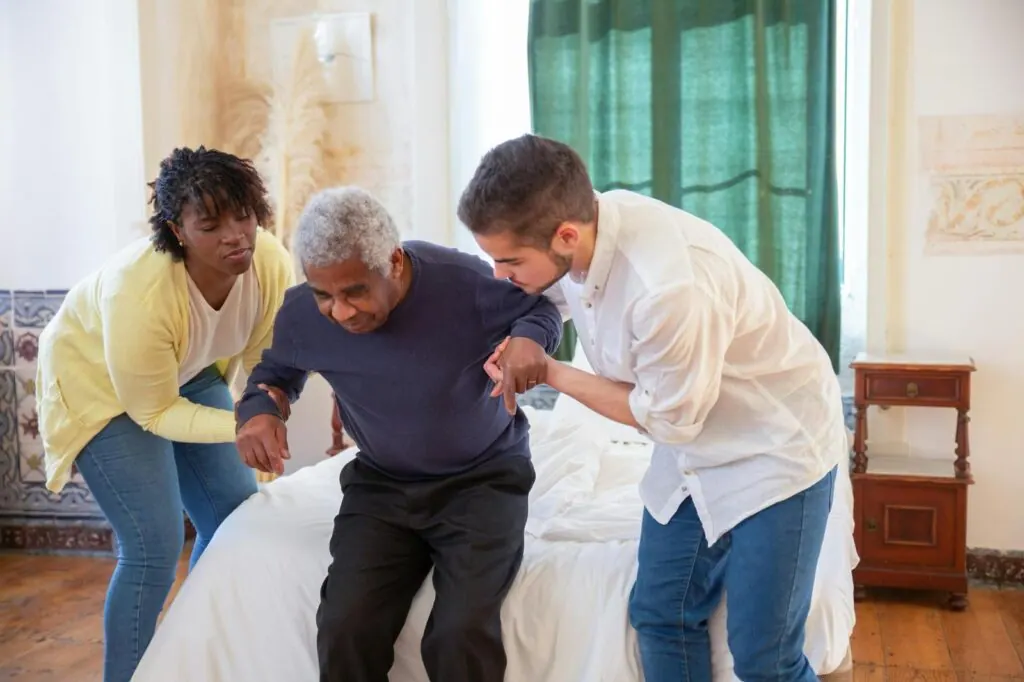 Caregiver gently helping a resident