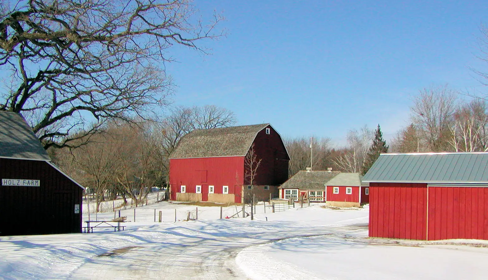 Red barns at the Holz Family Farmstead in Eagan, Minnesota, in winter